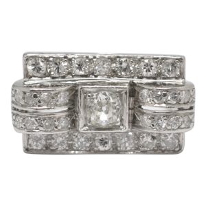 French diamond and platinum ring from the late Art Deco period; this is a superb example of Art Deco design with its clear geometric lines and architectural shape.